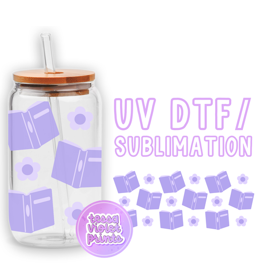 a glass jar with a lid and a straw in front of a white background with