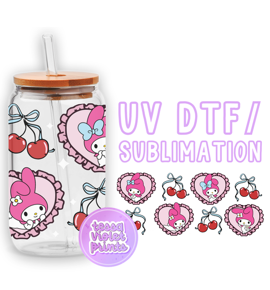 a pink hello kitty drink bottle with a straw in front of it