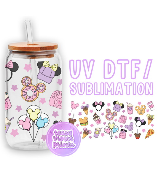 a glass jar with a straw lid and a sticker with a picture of a