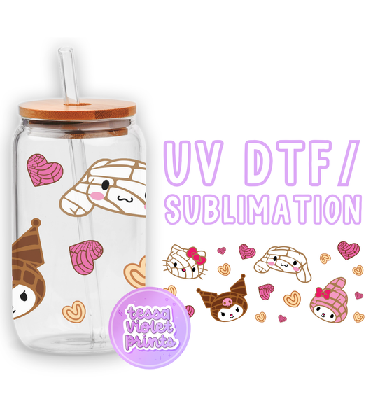 a glass cup with a straw lid and a sticker with a picture of a