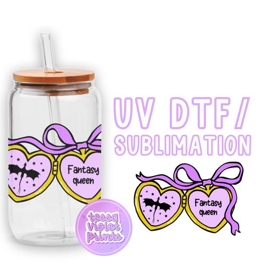 a glass jar with a straw lid and a sticker with a picture of two