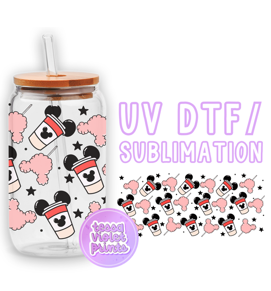 a glass jar with mickey mouse stickers on it