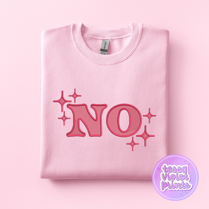 A pink sweatshirt with the word "NO" printed on it, along with stars.