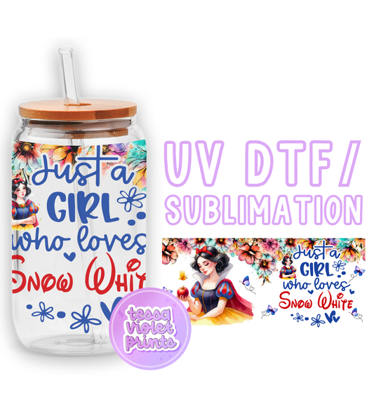 a glass jar with a straw lid and a sticker with a picture of snow