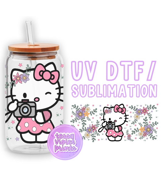 a hello kitty water bottle with a hello kitty sticker next to it