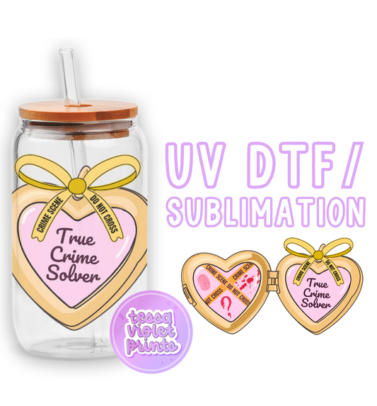 a glass jar with two hearts and a straw in it