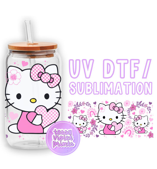 a hello kitty drink bottle with a straw in it